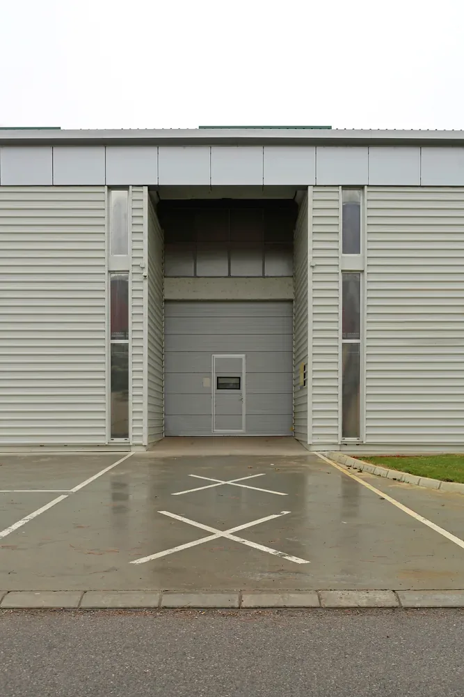 Commercial overhead roll-up dock door and personnel entrance on an Atlanta facility