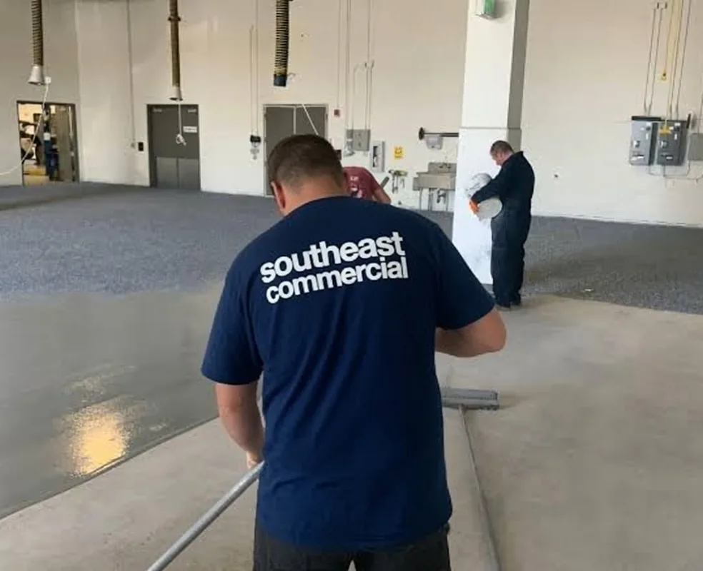 Commercial epoxy flooring crew installing a resinous floor coating in an Atlanta facility