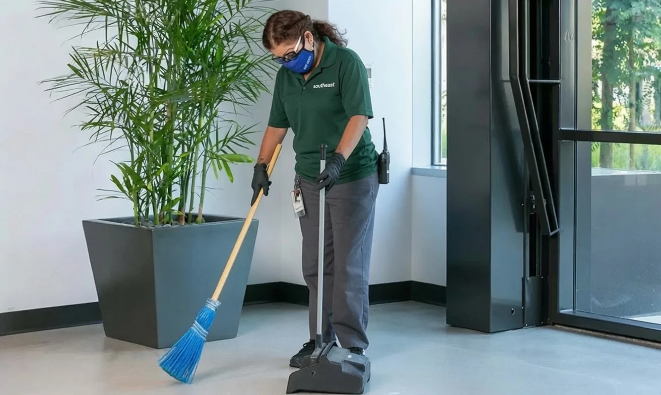 Southeast Commercial Services janitorial staff sweeping a commercial office lobby in Atlanta